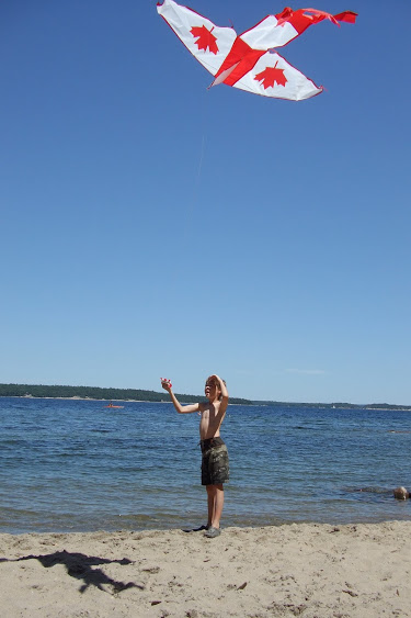 flying a kite on the beach at Killbear Provincial Park