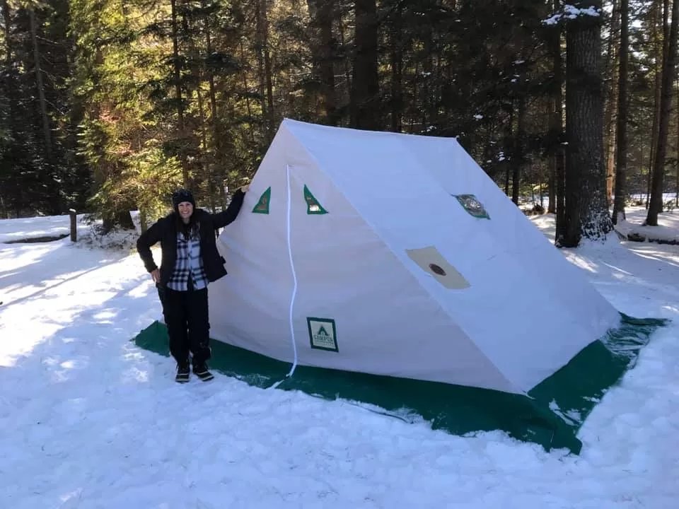 picture of a woman beside a hot tent while winter camping, camper christina