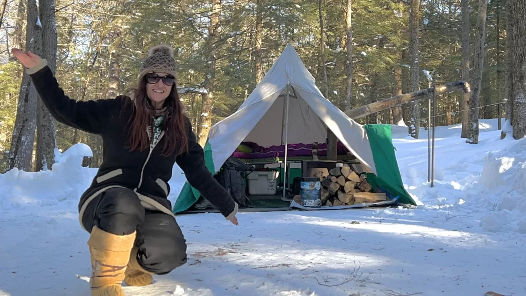 picture of Camper Christina in front of her homemade winter camping tent
