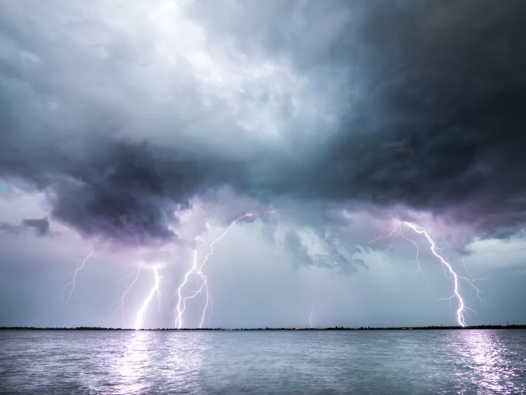 picture of a thunderstorm over a lake while camping
