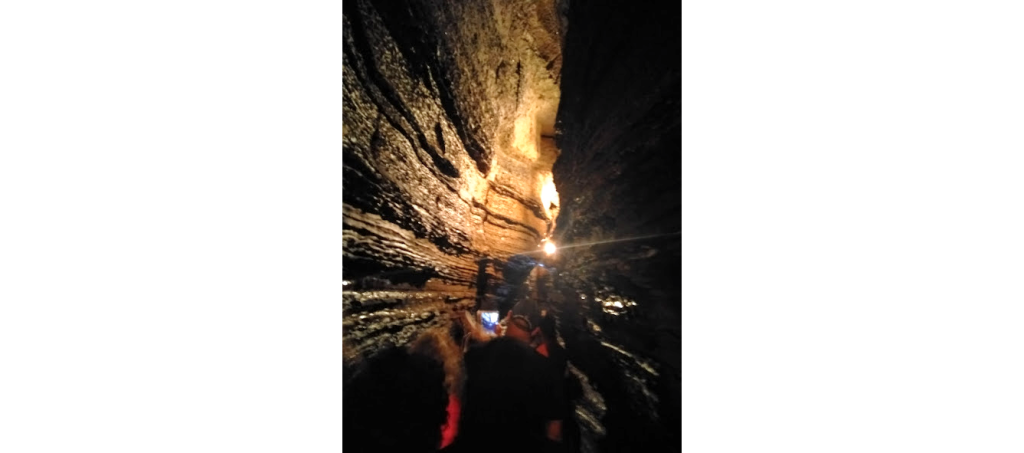 picture of people exploring the Bonne Chere caves near Bon Echo Provincial Park in Eganville Ontario