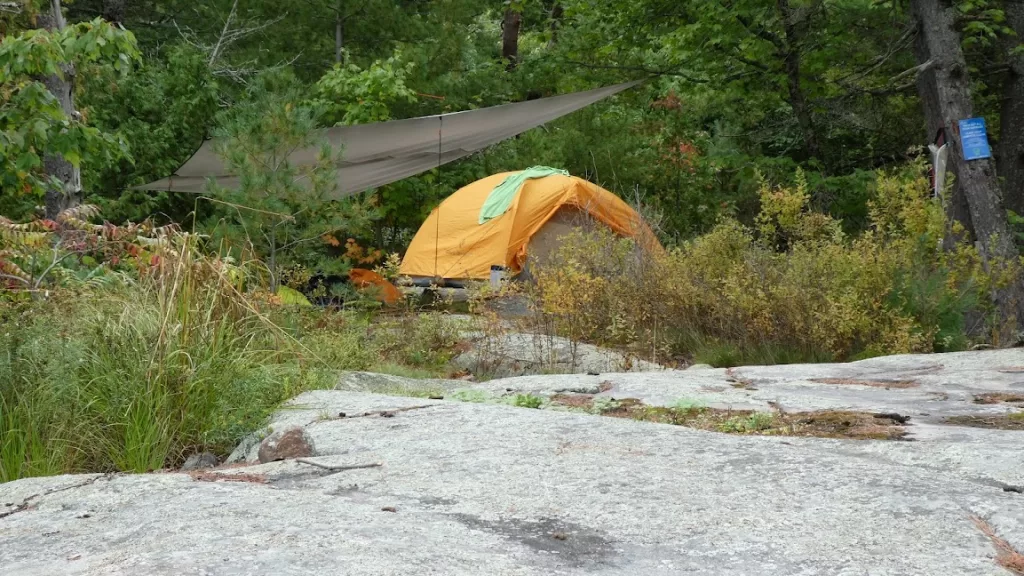 picture of a tent with a tarp over it while backcountry camping