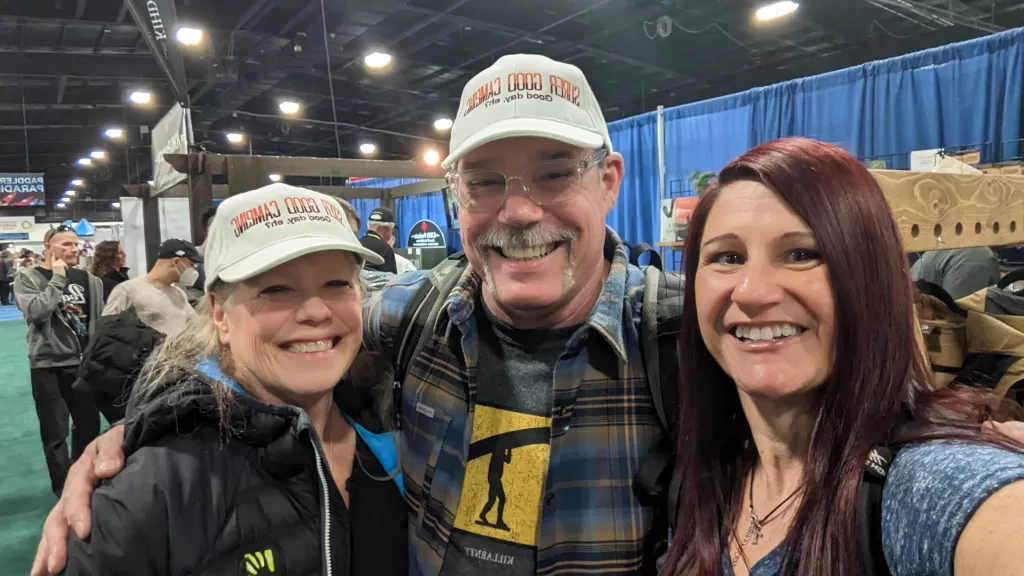 picture of Pamela and Tim with Camper Christina at the Outdoor Adventure Show in Toronto
