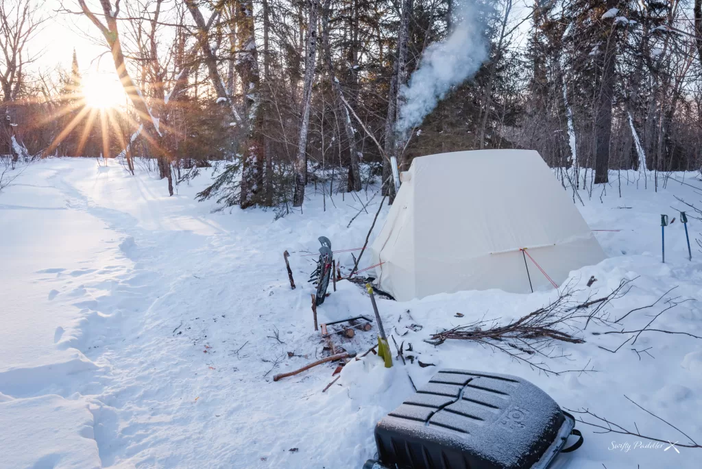 picture of a hot tent while winter camping in the backcountry